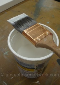 Strained primer and paintbrush